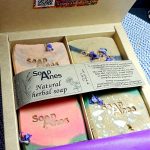 A gift set of natural herbal soap in a decorated box